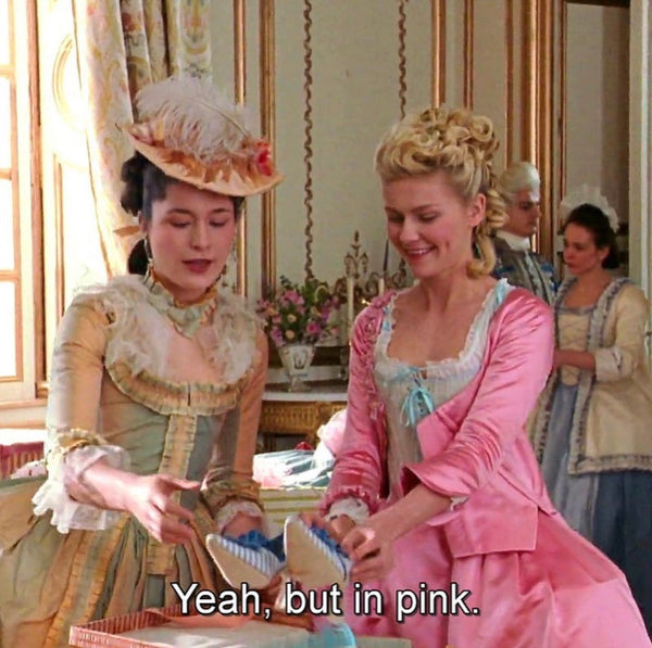 Two woman talking about pink color 