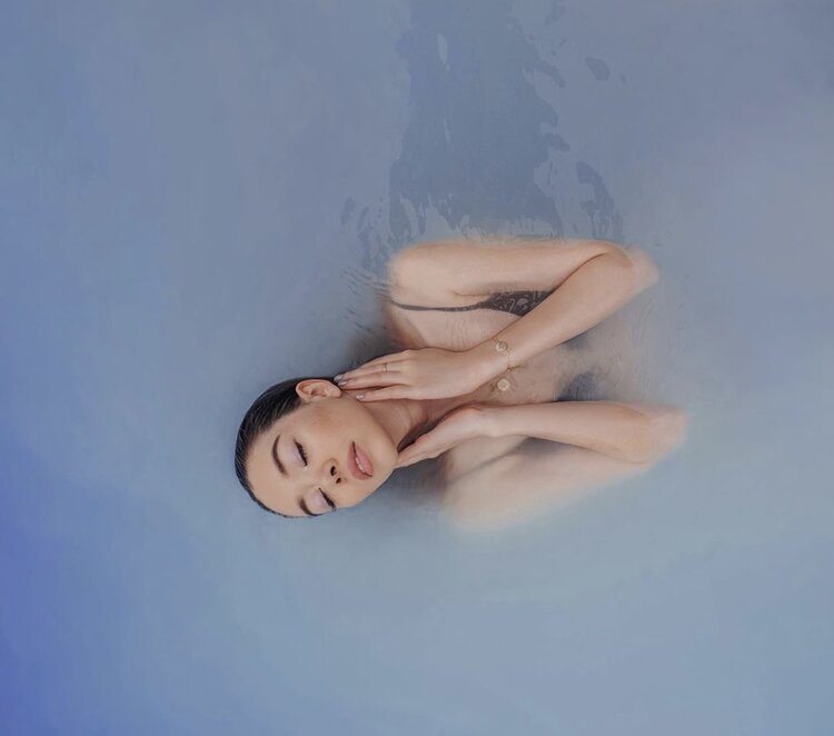 Woman with a beautiful skin in the water