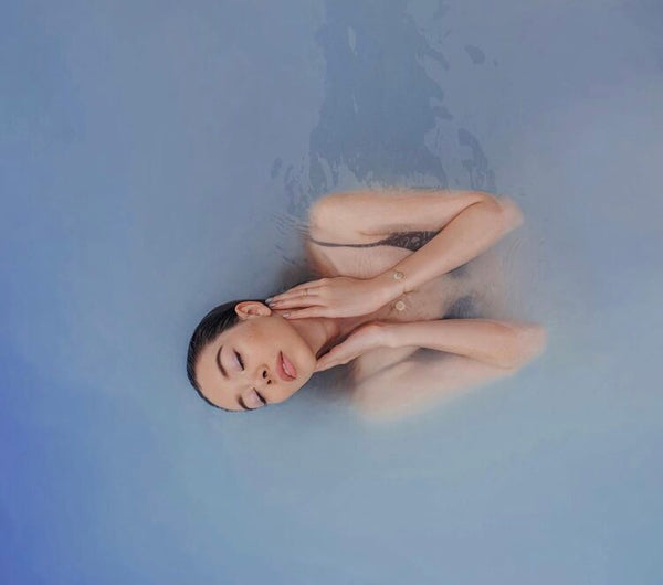 Woman with a beautiful skin in the water